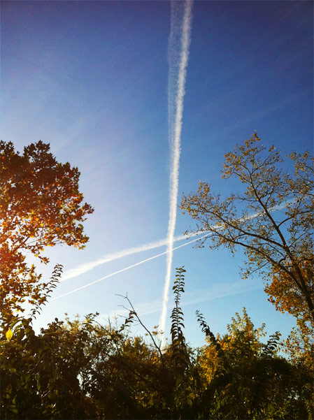 blue sky rocketship contrail photo