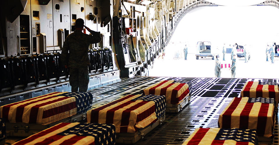 The remains of the Nov. 5 massacre victims at Fort Hood, Texas are loaded aboard an aircraft 